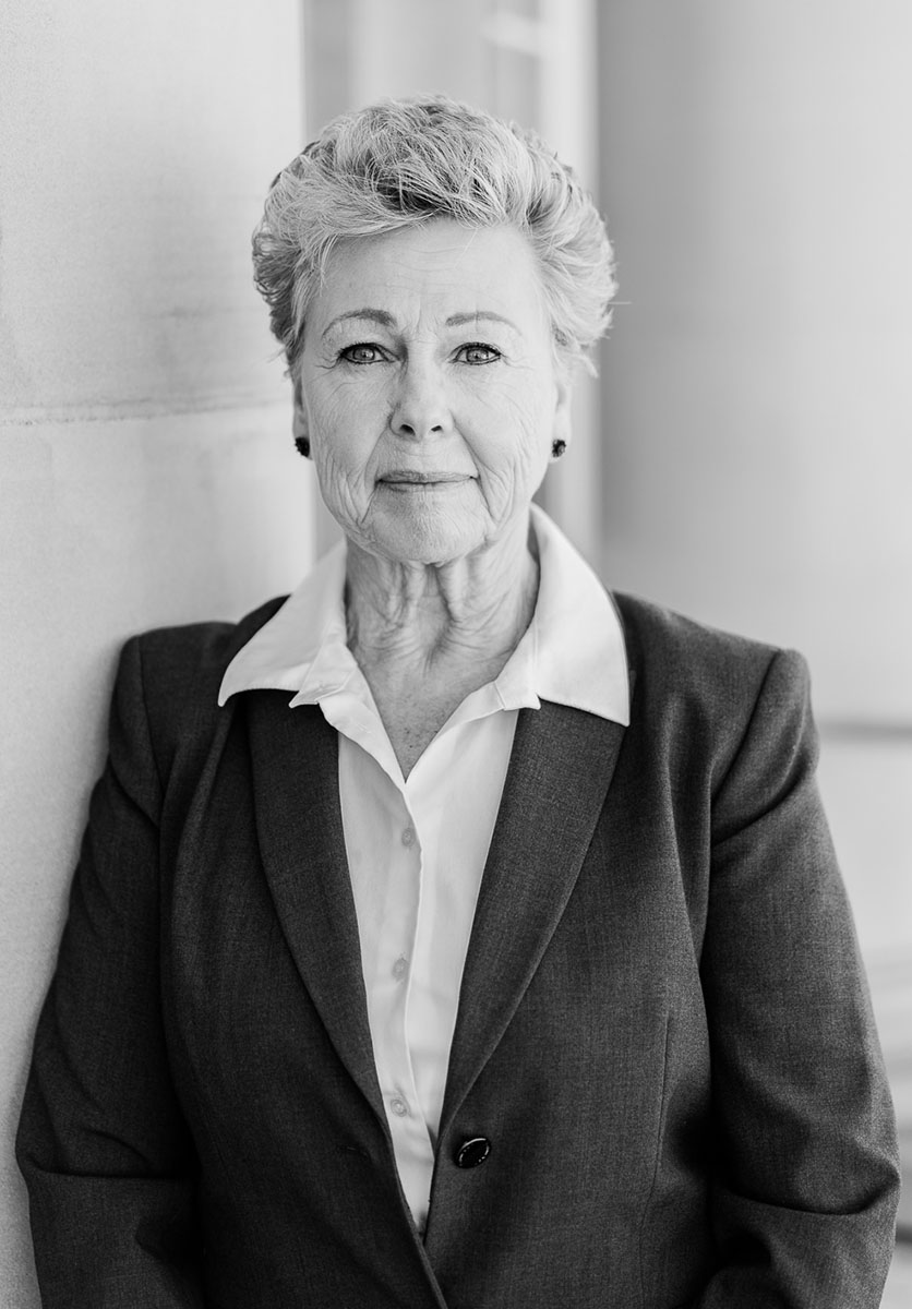 Kathy Carlson, CFDE, CQDE, certified and court-qualified forensic document examiner, professional portrait in black and white.